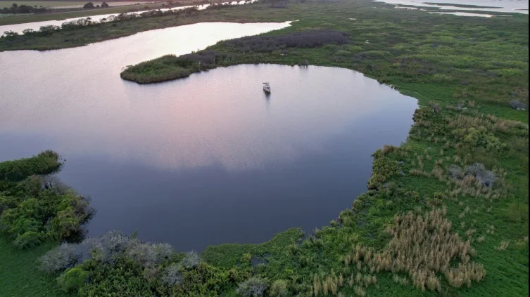 A calm, wide shot of Lake Leonida from an aerial perspective.